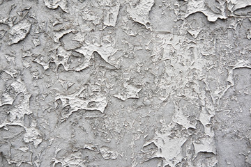 The texture of the concrete wall from which the paint peeled off. Texture of the destroyed concrete wall for design.