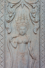 Fototapeta na wymiar The angle statue of ancient Khmer.