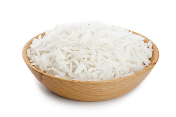 rice in a wooden bowl isolated on white background. Top view. Flat lay