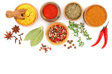 mix of spices in wooden bowl isolated on a white background with copy space for your text. Top view. Flat lay. Set or collection