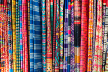 Beautiful colorful hand woven fabric clothes from pure natural silk thread textile old style original tradition patterns designed in Thailand