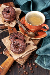 Cup of coffee and chocolate donuts