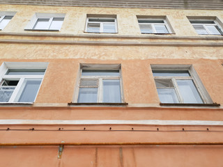 Old architectural building. An ancient residential building in the city.