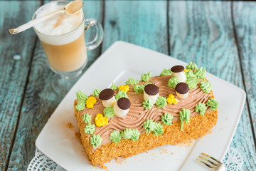 Delicious cake with coffee latte on wooden table