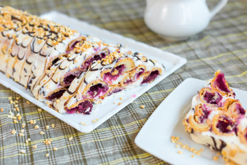Bakery delicious food concept. Big tasty cake with nuts and cherry inside with cream 