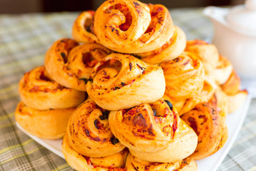 Yellow baked cakes with cheese and bacon