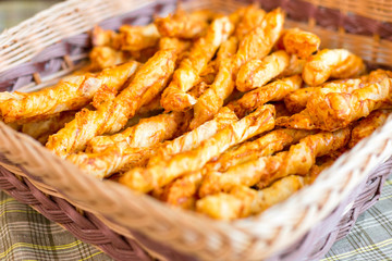 Cheese chips on plate. Baked tasty snack, food photo concept