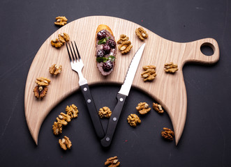 sandwich on a blackboard with a knife cutter