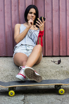 Hipster girl using smartphone
