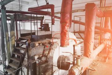 interior of the production room of the boiler station for residential heating, old and abondoned station