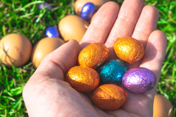 Colorful Easter Eggs Lie In Hand
