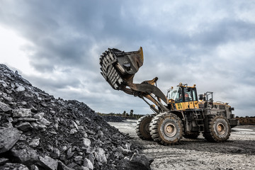 Close up view of a bulldozer moving some rocks at a mine in Victoria Australia © Michael Evans