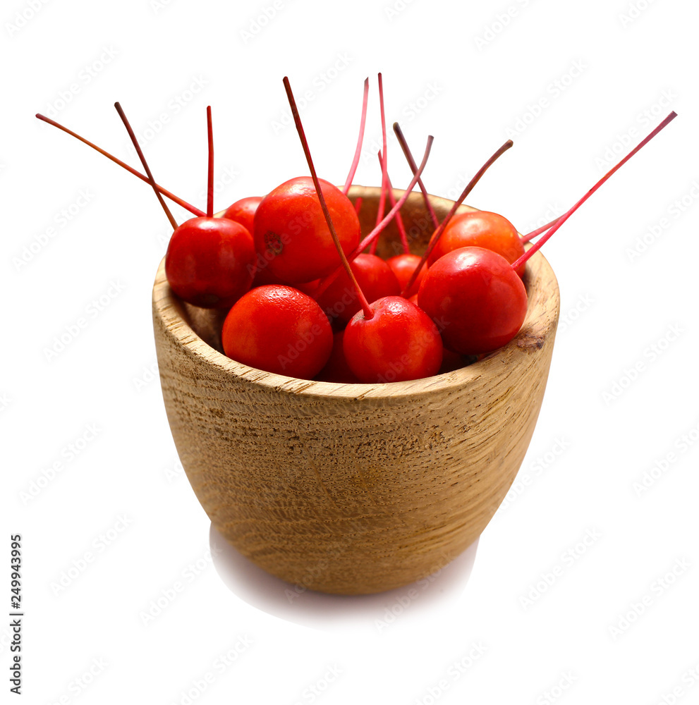 Wall mural berries in a wooden cup. fresh sweet berries. ripe red on a isolated