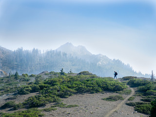 woman hiking alone mountains