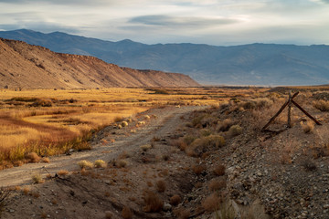 rural country road in autumn grassy landscape valley Sierra Nevadas, California