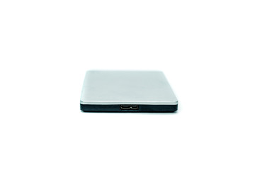 Gray portable hard drive. The concept of data storage on an external medium. Backing up files, protecting files.