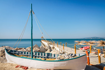 Old boat on empty seaside beach, Bulgaria