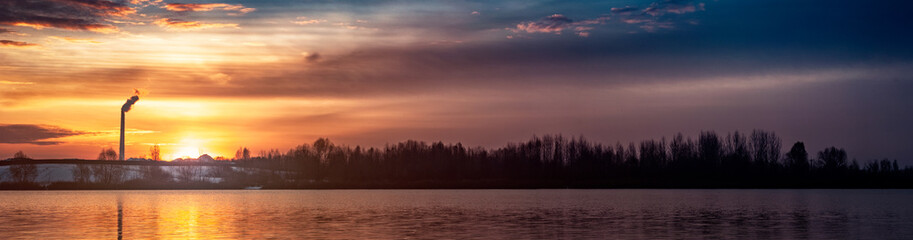 Fototapeta premium Morning sunrise lake with forest on the horizon in Kyiv Ukraine