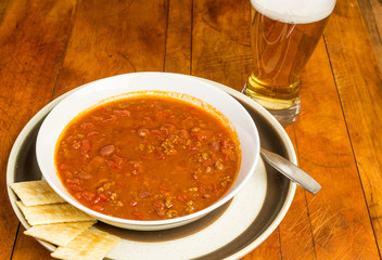 Chili and Beer with Crackers in Rustic Setting