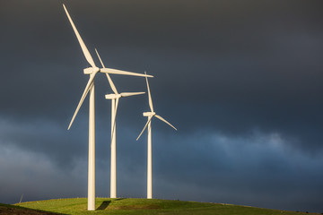 Wind turbines at a wind farm in Victoria Australia during striking late afternoon light