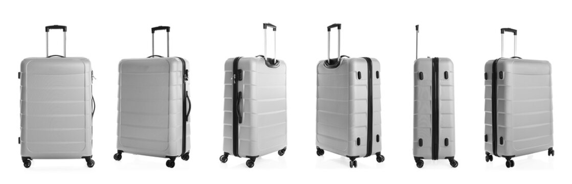 Set of stylish light suitcase for travelling on white background