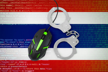 Thailand flag  and handcuffed computer mouse. Combating computer crime, hackers and piracy