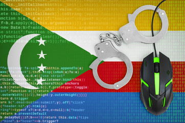 Comoros flag  and handcuffed computer mouse. Combating computer crime, hackers and piracy
