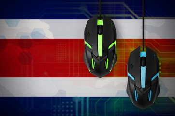 Costa Rica flag  and two mice with backlight. Online cooperative games. Cyber sport team