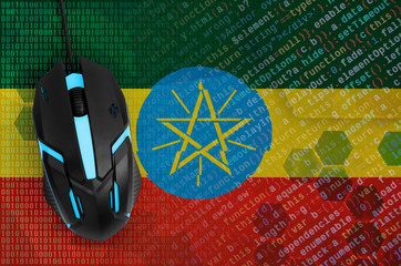 Ethiopia flag  and computer mouse. Digital threat, illegal actions on the Internet