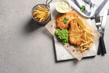 British traditional fish and potato chips on table, top view with space for text