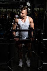 Muscular Man After Exercise Resting In Gym