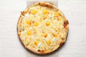 Hot cheese pizza Margherita on white wooden background, top view