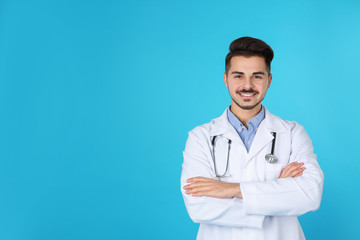 Fototapeta premium Young medical student on color background. Space for text