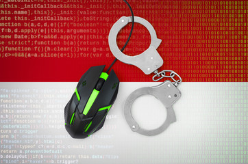 Indonesia flag  and handcuffed computer mouse. Combating computer crime, hackers and piracy