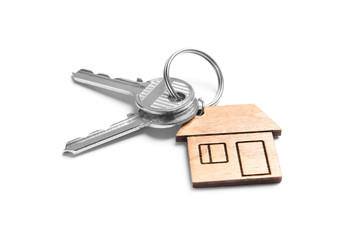 House keys with trinket on white background