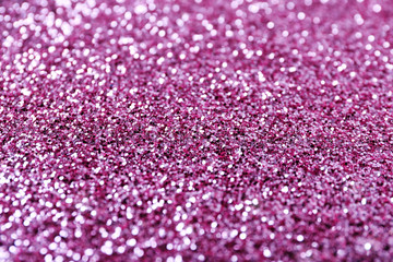 Texture of rose gold glitter as background, closeup