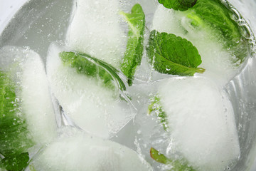 Drink with mint and ice cubes, top view