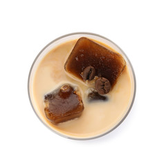 Glass of milk with coffee ice cubes on white background, top view