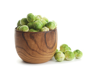 Bowl of fresh Brussels sprouts isolated on white