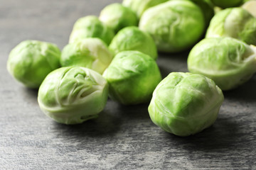 Fototapeta premium Fresh Brussels sprouts on grey table, closeup