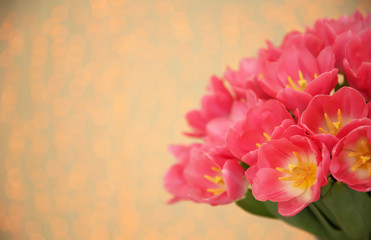 Beautiful spring tulips on blurred background, closeup with space for text. International Women's Day