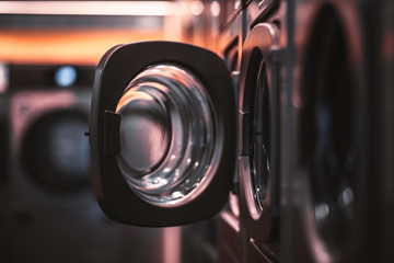 Dark laundry room with opened door