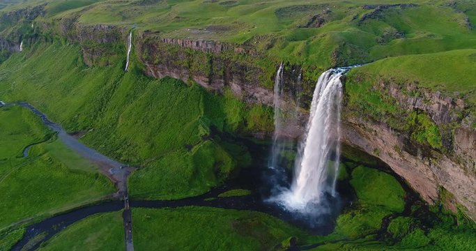 Iceland Aerial drone 4K video of waterfall Seljalandsfoss in Icelandic nature. Famous tourist attractions and landmarks destinations in Icelandic nature landscape in South Iceland.