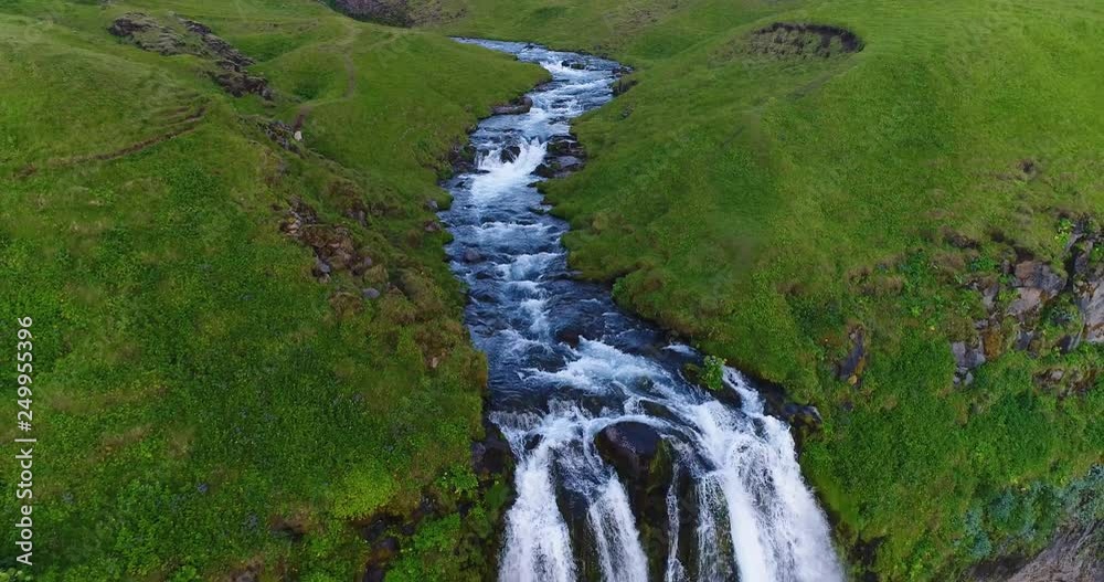 Wall mural Aerial drone footage of waterfall Seljalandsfoss on Iceland in Icelandic nature. Famous tourist attractions and landmarks destinations in Icelandic nature landscape on the ring road, South Iceland.