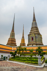 Thailand, Bangkok, Wat Pho is a Buddhist temple in Phra Nakhon district, Bangkok, Thailand. It is located in the Rattanakosin district directly adjacent to the Grand Palace