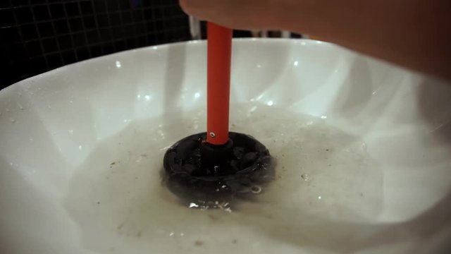 plunger trying to remove clogged sinks