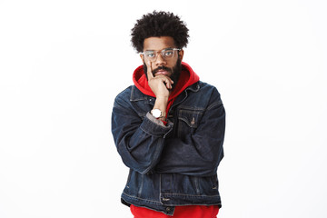 Serious-looking throughtful good-looking african-american hip-hop dancer with beard in glasses and...