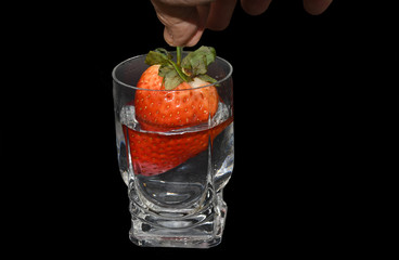 Big strawberry in a glass