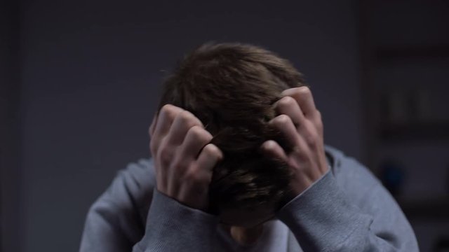 Teen criminal feeling guilty regretting about committing crime, juvenile justice