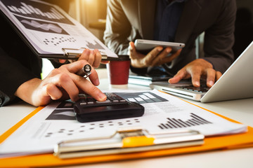 Business team meeting. professional investor working new start up project. Finance task. with smart phone and laptop and digital tablet computer  in morning light